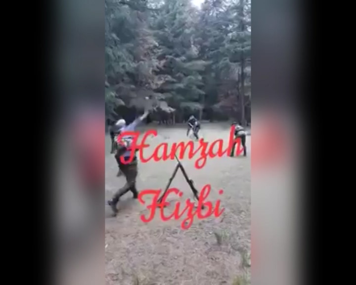 Padded with arms and ammunition, Hizbul militants play cricket Padded with arms and ammunition, Hizbul militants play cricket