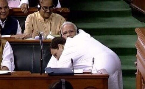 No Confidence Motion: Rahul hugs Modi in Parliament No Confidence Motion: Rahul Gandhi hugs PM Narendra Modi in Parliament