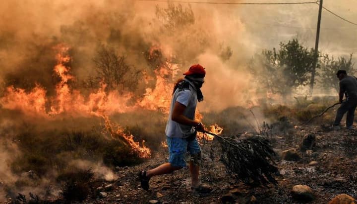 At least 74 people were killed, scores injured and many remained unaccounted for after wildfires spread rapidly through a popular vacationing spot on the Greek coast east of Athens, turning it into a disaster area that left the country reeling and in desperate need of firefighting reinforcements from the European Union on Tuesday. Image: Aris Messinis, AFP