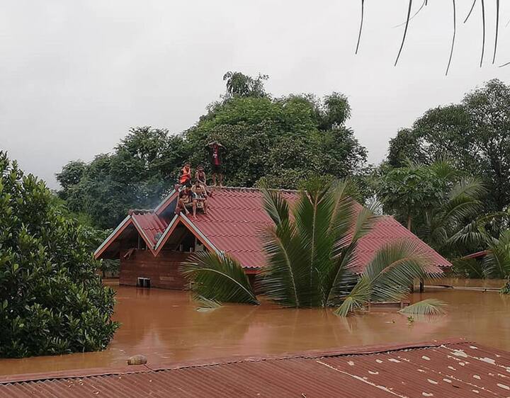 The remote area is only accessible by helicopter and flat-bottomed boats, with roads badly damaged by the flash flooding or completely washed away. AFP PHOTO / ATTAPEU TODAY