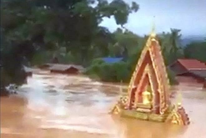 The South Korean partner in the hydropower project said that on Wednesday it discovered the upper part of the structure had washed away 24 hours before it collapsed. AFP PHOTO / ATTAPEU TODAY