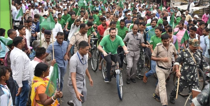 Bihar: Tejashwi Yadav kickstarts 100-km cycle rally against Nitish govt, rain cuts short to just 35 km Bihar: Tejashwi Yadav kickstarts 100-km cycle rally against Nitish govt, rain cuts short to just 35 km