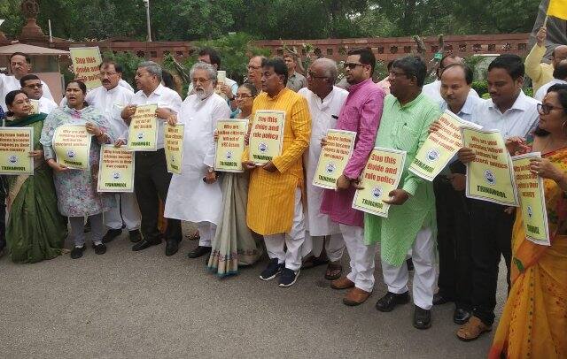 Various parties including TMC, Aam Aadmi Party and Samajwadi Party MPs staged protest in front of Gandhi statue in parliament premises on Tuesday