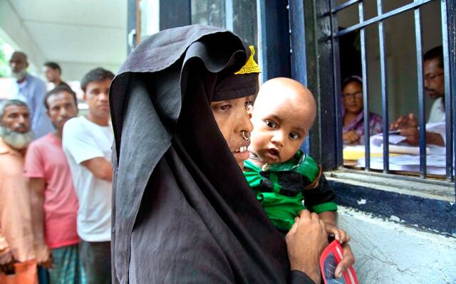 A woman at the NRC center. PIC/AP.