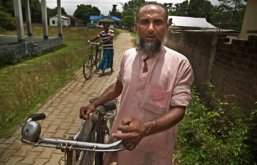 Abdul Manan, a Muslim man returns after finding that his name is not included in the National Register of Citizens draft in Mayoung, about 55 kilometers (34 miles) east of Gauhati, India, Monday, July 30, 2018. India on Monday released a final draft of a list of its citizens in the northeastern state of Assam, leaving some 4 million people on edge to prove their Indian nationality. (AP Photo/Anupam Nath)