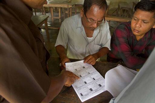 People check if their names are included in the National Register of Citizens at a draft center in Mayoung, about 55 kilometers (34 miles) east of Gauhati, India, Monday, July 30, 2018. PIC/AP.