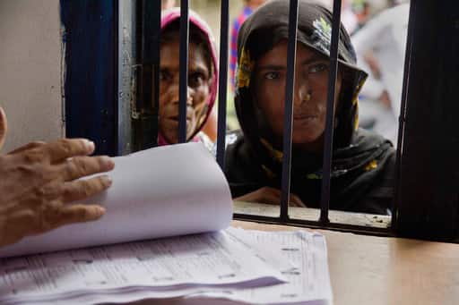 Women stand in a queue to check if their names are included in the National Register of Citizens at a draft center in Mayoung, about 55 kilometers (34 miles) east of Gauhati, India, Monday, July 30, 2018. PIC/AP.