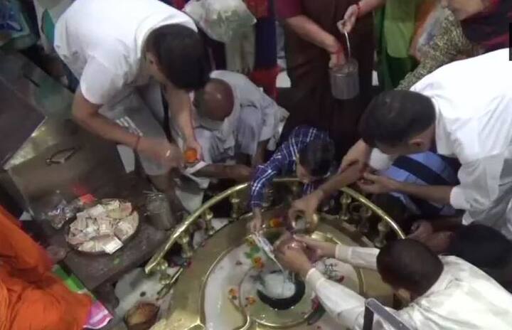 The second Monday of the religiously significant Hindu month Sawan was marked with zeal across the country. Devotees offer milk and water to the Shivling at Daksha Mahadev Temple in Haridwar /Image: ANI