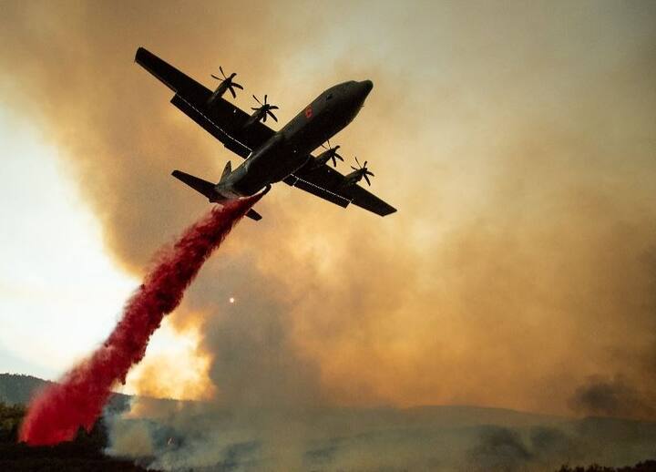 The two fires have not merged, but officials are counting them as one. (AFP Image)