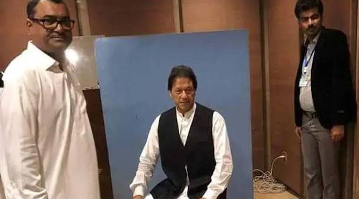 Watch: Imran Khan borrows waistcoat from National Assembly employee for official photo Watch: Imran Khan borrows waistcoat from National Assembly employee for official photo