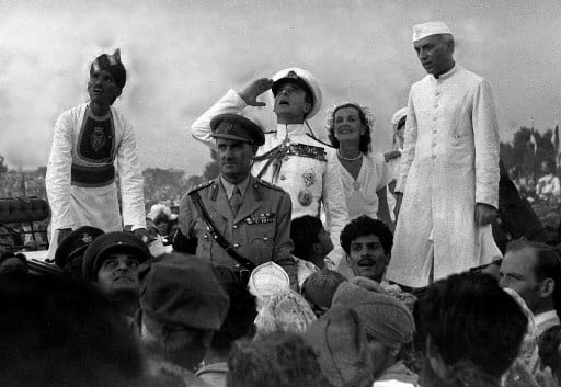 British Governor-General Lord Mountbatten (C) gestures alongside Lady Edwina Mountbatten (2R) and Indian Prime Minister Jawaharlal Nehru (R) as they witnesses the raising of the Indian Tricolour for the first time at India Gate in New Delhi (Image: AFP /HO-Directorate of Public Relations)