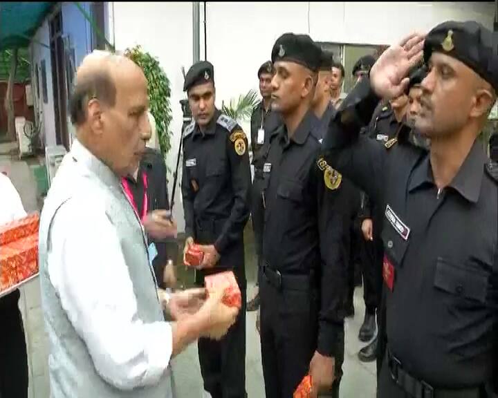 He gave sweets to security personnel at his residence.
