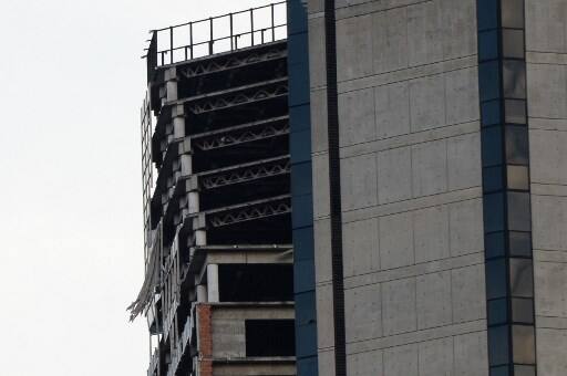 An unfinished skyscraper known as Tower of David, that is abandoned, leaned after the earthquake. Image: AFP/ Federico Parra