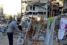 PICTURES: These artists translate suffering of a war-torn country into art at Syria\'s Yarmuk camp