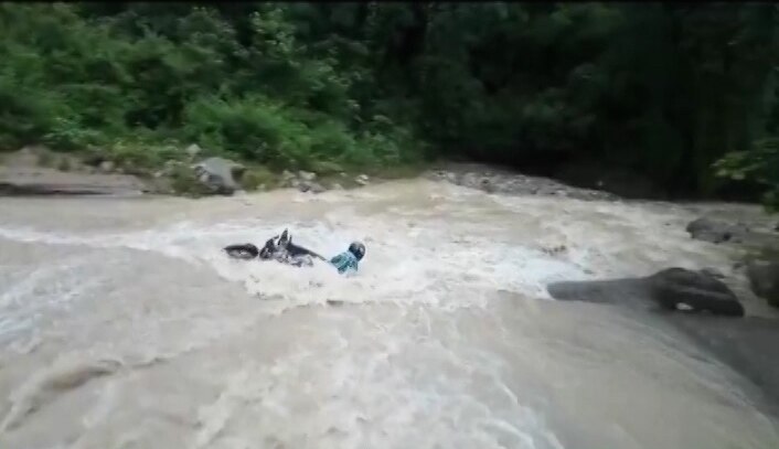 SHOCKING VIDEO: Biker drowns as he tries to cross seasonal drain in Uttarakhand; later saved by locals SHOCKING VIDEO: Biker drowns as he tries to cross seasonal drain in Uttarakhand; later saved by locals