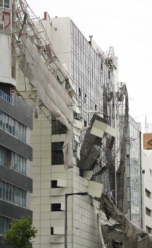 Damage from loose construction scaffolding due to weather patterns from Typhoon Jebi./ /IMAGE: AFP/ JIJI PRESS