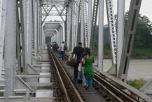 IN PICS: Tourists Forced To Walk On Railway Bridge After Massive Landslide Blocks NH 31-C Near Siliguri