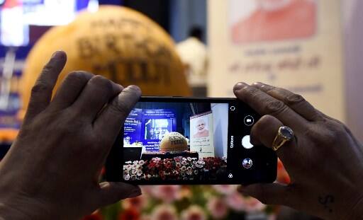 NEW DELHI: A giant, 568-kg ladoo was unveiled on the occasion of Prime Minister Narendra Modi's 68th birthday on Monday by Union Minister Prakash Javadekar and his cabinet colleague Mukhtar Abbas Naqvi. (AFP Image)