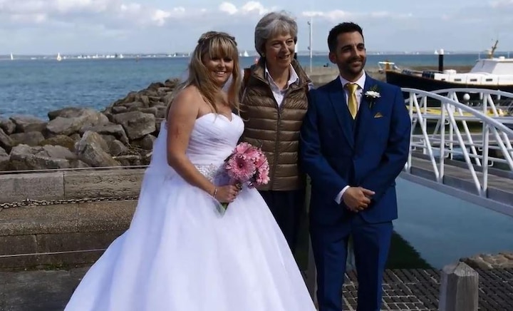 VIRAL: British PM Theresa May gatecrashes this couple's wedding; poses for pictures, says 