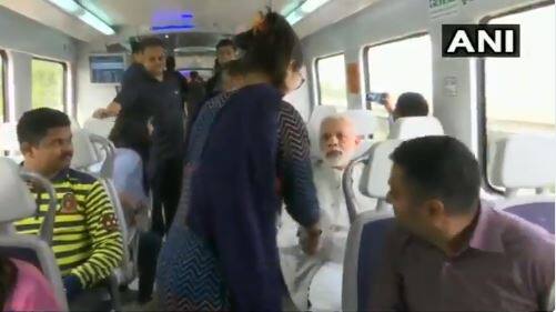 The prime minister, during his ride, talked to some co-passengers, who clicked selfies with him. Photo: ANI