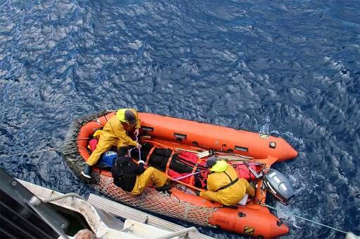 The Indian Navy Commander who was on a solo circumnavigation race, was struck by a storm which ravaged his boat, cracking both masts with him getting a severe back injury. (AFP IMAGE)