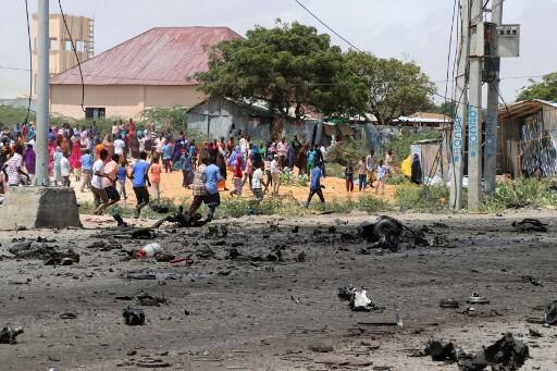 The blast occurred near the Somali Defence Ministry where a convoy of Italian troops was passing by. The police said no member of the Italian troops were killed or injured./ AFP PHOTO / Abdirazak Hussein FARAH