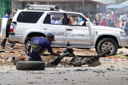 A suicide bomber rammed a vehicle loaded with explosives into a vehicle carrying a European Union military convoy and injured two civilians, police said. Al-Shabaab Islamists claimed responsibility for the attack. / AFP PHOTO / Abdirazak Hussein FARAH