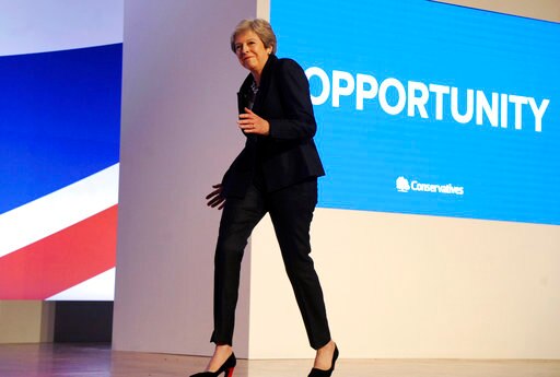 WATCH! British PM Theresa May does her 'awkward' dance again and this time on stage; breaks the internet WATCH! British PM May does her 'awkward' dance again and this time on stage! Internet loses calm