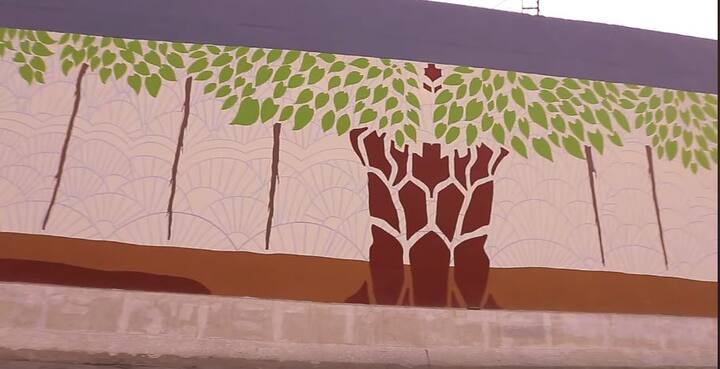 The underpass, which took a little over a month to be painted, will showcase paintings of ‘Kalpavriksha' -- the auspicious wishing tree in Indian mythology -- by artists Laxman Singh and Kunal Jain. /Image: Screengrab from video shared by Kiran Nadar Museum of Art on Facebook