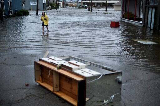 Two people, including a child, were killed by falling debris, the US media reported on Thursday. Hundreds of thousands of homes and businesses were left without electricity in Florida, Alabama and Georgia. (Photo by Brendan Smialowski / AFP)