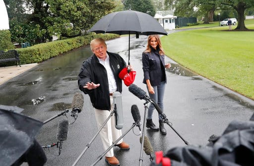 For some or the other reason US President Donald Trump ends up becoming the target of trolls on social media. This time again, he became the subject of ridicule as he hogged the umbrella leaving his wife Mealania Trump soaking in the rain, while leaving for an official trip. (AP Photo/Pablo Martinez Monsivais)