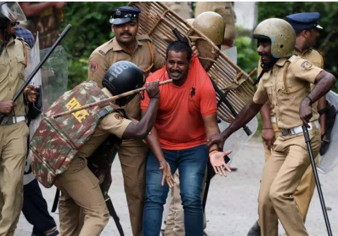 The Lord Ayyappa devotees, who are opposing the decision of Kerala government to implement the Supreme Court's order of lifting a ban on entry of women of menstrual age into the temple, were lathi-charged by the police. Image: PTI