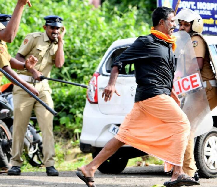 A protester being chased by the police / Image: PTI