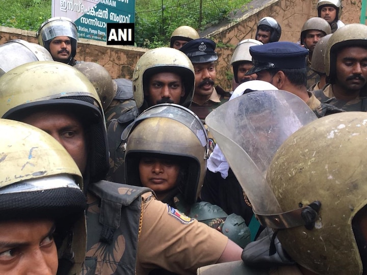 2 women reach Sabrimala Temple with police protection; Blocked by protesters, priest 2 women reach Sabrimala Temple with police protection; Blocked by protesters, priest