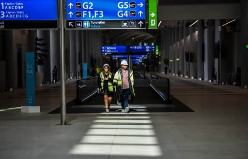 Overall the first phase has costed 7.5 billion Euro. It has been constructed by - IGA - which is a consortium of companies under a public private partnership (PPP) model. (Photo by BULENT KILIC / AFP)