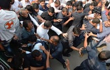 IN PICTURES: Rahul Gandhi climbs barricades, hangs out of car- Here\'s his never seen \'avatar\' during Congress\' protest over CBI row