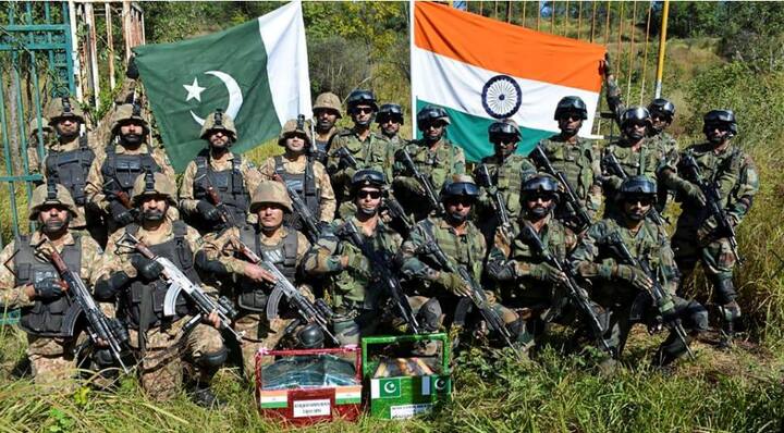 Poonch: Indian and Pakistani army men pose for a group photograph after exchanging sweets on the occasion of Diwali festival, in Poonch, Tuesday, Nov 6, 2018. (PTI Photo)