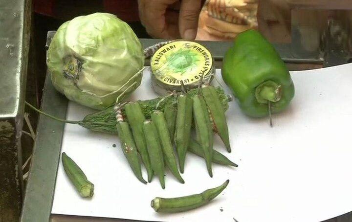 Delhi: Traders putting crackers inside vegetables to protest against SC 'Green Diwali' order Delhi: Traders putting crackers inside vegetables to protest against SC 'green crackers' order