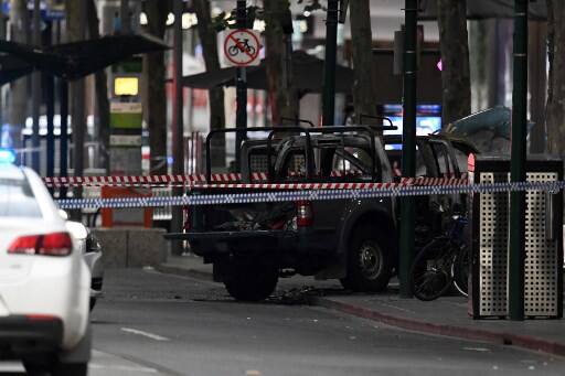 In the incident, a car exploded on Bourke Street, near the intersection with Swanston Street. / AFP IMAGE