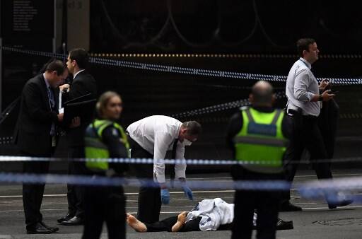 A man, believed to be the driver, stabbed three people and was then shot by police. / AFP IMAGE