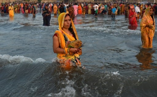 The festival is celebrated on the sixth day after Diwali. Chhath Puja relives the age-old tradition of paying obeisance to the Sun God. / AFP Image
