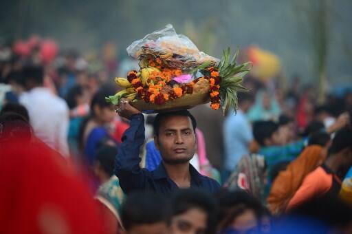 The festival will conclude with the devotees offering 'Arghya' to the rising Sun tomorrow. / AFP Image