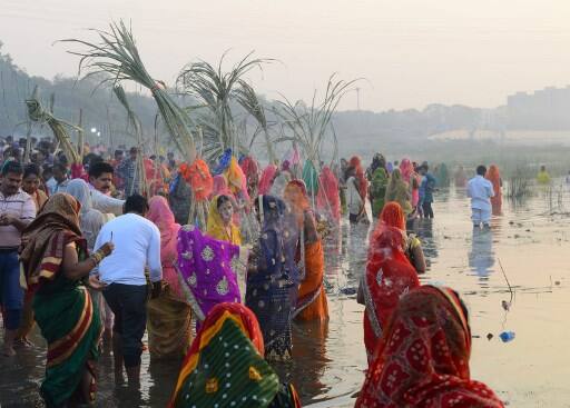 Thousands of devotees also assembled in the ghats of the river. / AFP Image