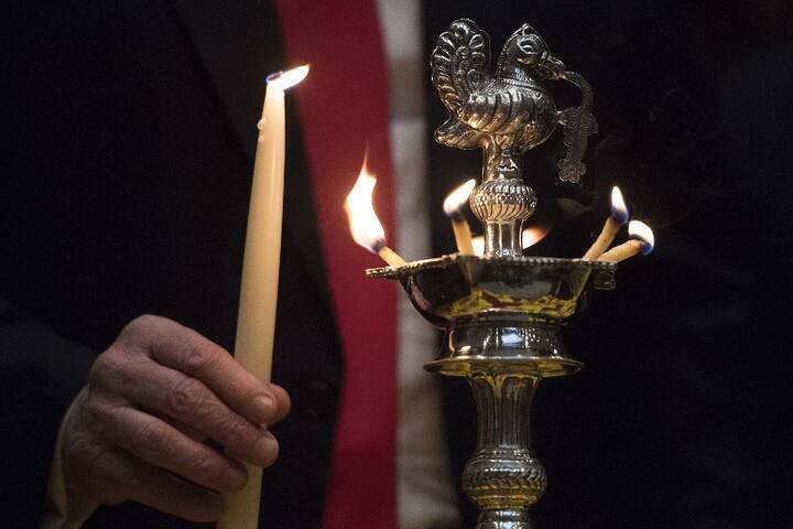  Trump lit a diya during the Roosevelt Room ceremony. AFP Photo