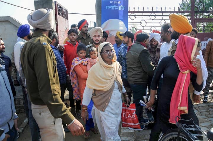 People come out of the Nirankari Bhawan, where two men on a motorcycle reportedly threw a grenade during a religious congregation, in Adliwal village near Amritsar, Punjab. PTI Photo