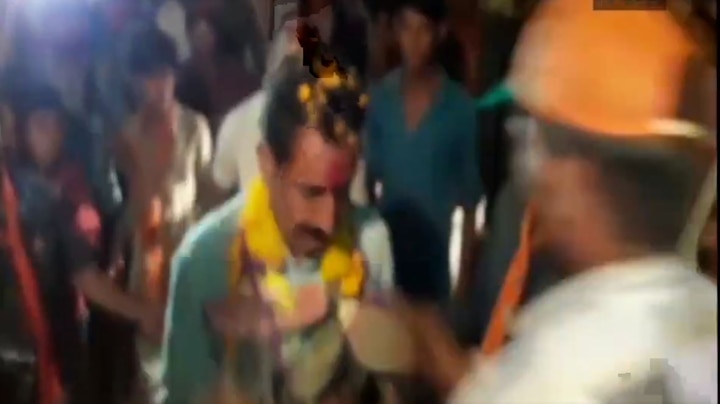 WATCH: Man garlands unsuspecting BJP MLA with shoes in public rally; gets thrashed by supporters WATCH: Man garlands BJP MLA with shoes in public rally; gets thrashed by supporters
