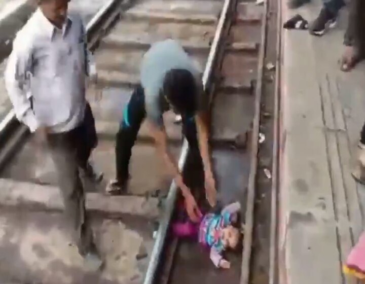 Miracle! 1-year-old escapes UNHURT after train runs over her; WATCH VIDEO Miracle! 1-year-old escapes UNHURT after train runs over her; WATCH VIDEO