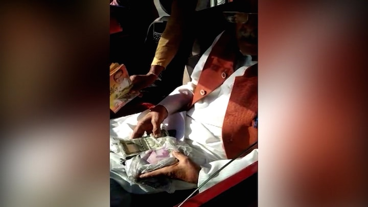 MP minister caught with Rs 10 lakh in car, Congress alleges 'cash-for-vote' MP minister caught with Rs 10 lakh in car, Congress alleges 'cash-for-vote'