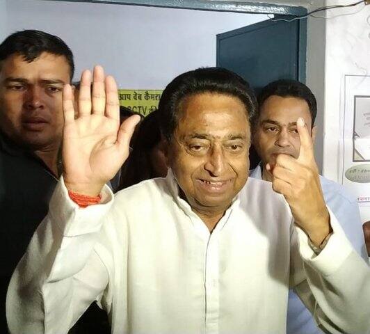 Senior Congress leader Kamal Nath casts vote in Chhindwara. He found himself in controversy after he flashed his party's symbol (palm) after casting vote/ ANI image 