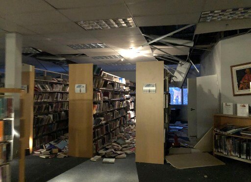 The 5.7 aftershock arrived within minutes, followed by a series of smaller quakes. A large section of an off-ramp near the Anchorage airport collapsed, marooning a car on a narrow island of pavement surrounded by deep chasms in the concrete. Several cars crashed at a major intersection in Wasilla, north of Anchorage, during the shaking. / AFP Image